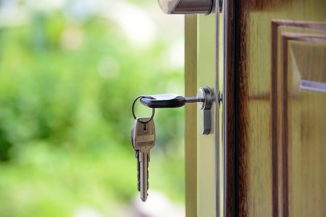 a key hanging in an open door