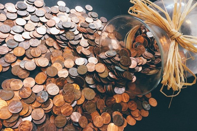 a knocked over jar of pennies