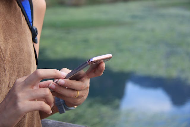 Pair of hands holding a smart phone